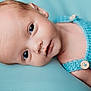 Tait joined the competition — help win amazing prizes! baby, infant, face, portrait, blue_background, knitted_clothing, button, newborn, skin, head, laying_down, peaceful, eyes_open, closeup, soft_texture, child, cute, young, human, resting