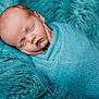 Tait is registered to the contest to win money with this photo: newborn, baby, sleeping, wrapped, blanket, blue, soft, cozy, portrait, infant, peaceful, cute, texture, knit, cushion, resting, closeup, child, head, hands