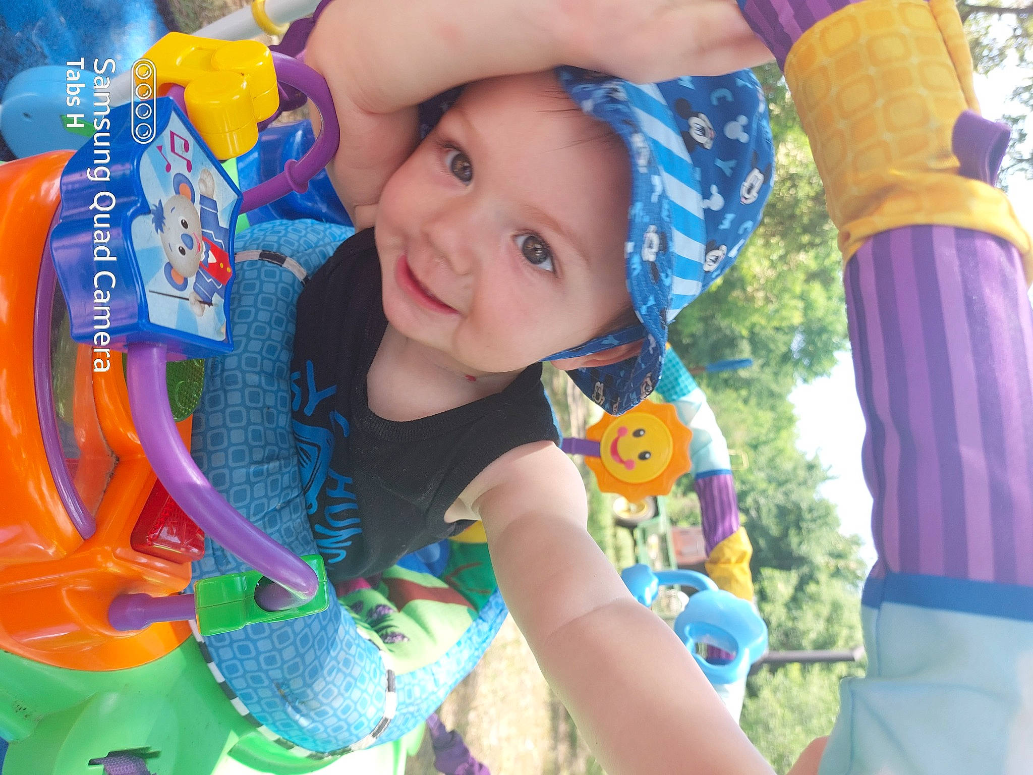 Talyn is registered to the contest to win money with this photo: aqua, baby_toddler_clothing, blue, child, electric_blue, face, fun, grass, happy, headwear, joy, leisure, organ, people_in_nature, person, photograph, product, recreation, smile, snapshot