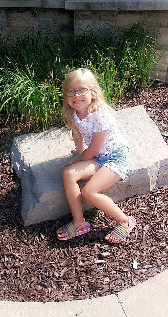 Paisley is registered to the contest to win money with this photo: botany, fawn, flash_photography, glasses, grass, green, hair, hairstyle, joy, leaf, leg, leisure, people_in_nature, person, photograph, plant, public_space, shoe, smile, sunlight