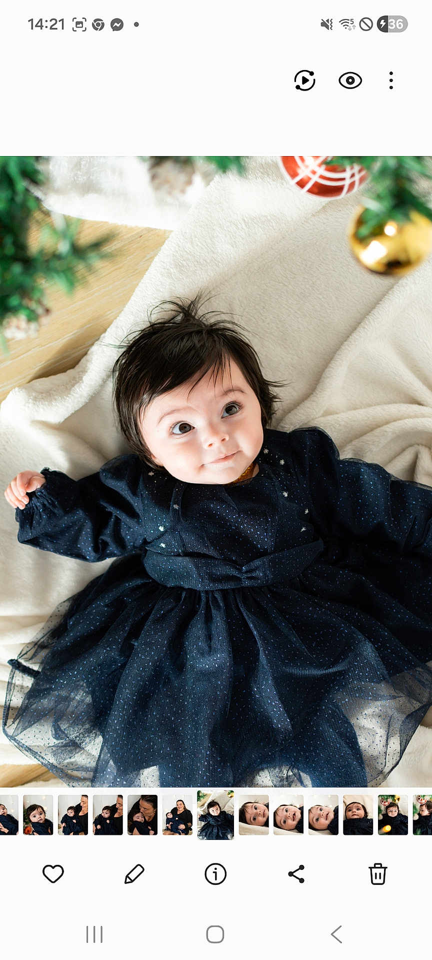 Ayana a rejoint le concours — aidez-le/la à gagner de superbes lots ! baby, child, infant, dress, navy_blue, blanket, face, eyes, hair, indoor, cute, adorable, holiday, ornaments, decorations, smile, lying_down, soft_texture, warm, cozy