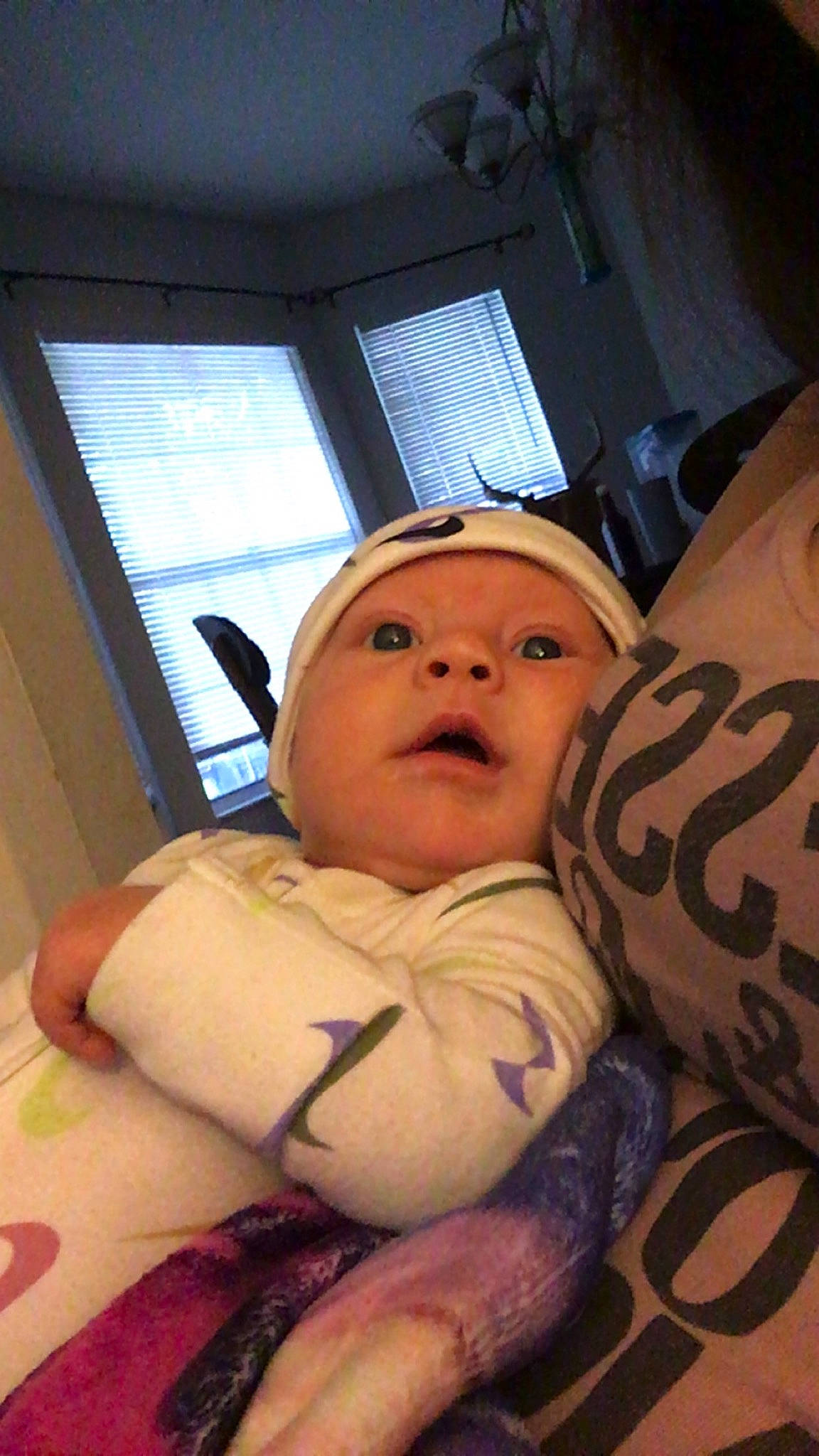 Karson joined the competition — help win amazing prizes! baby, bed, bedding, chair, cheek, child, comfort, flooring, fun, fur, hat, headwear, linens, person, personal_protective_equipment, room, sitting, stuffed_toy, thumb, toddler