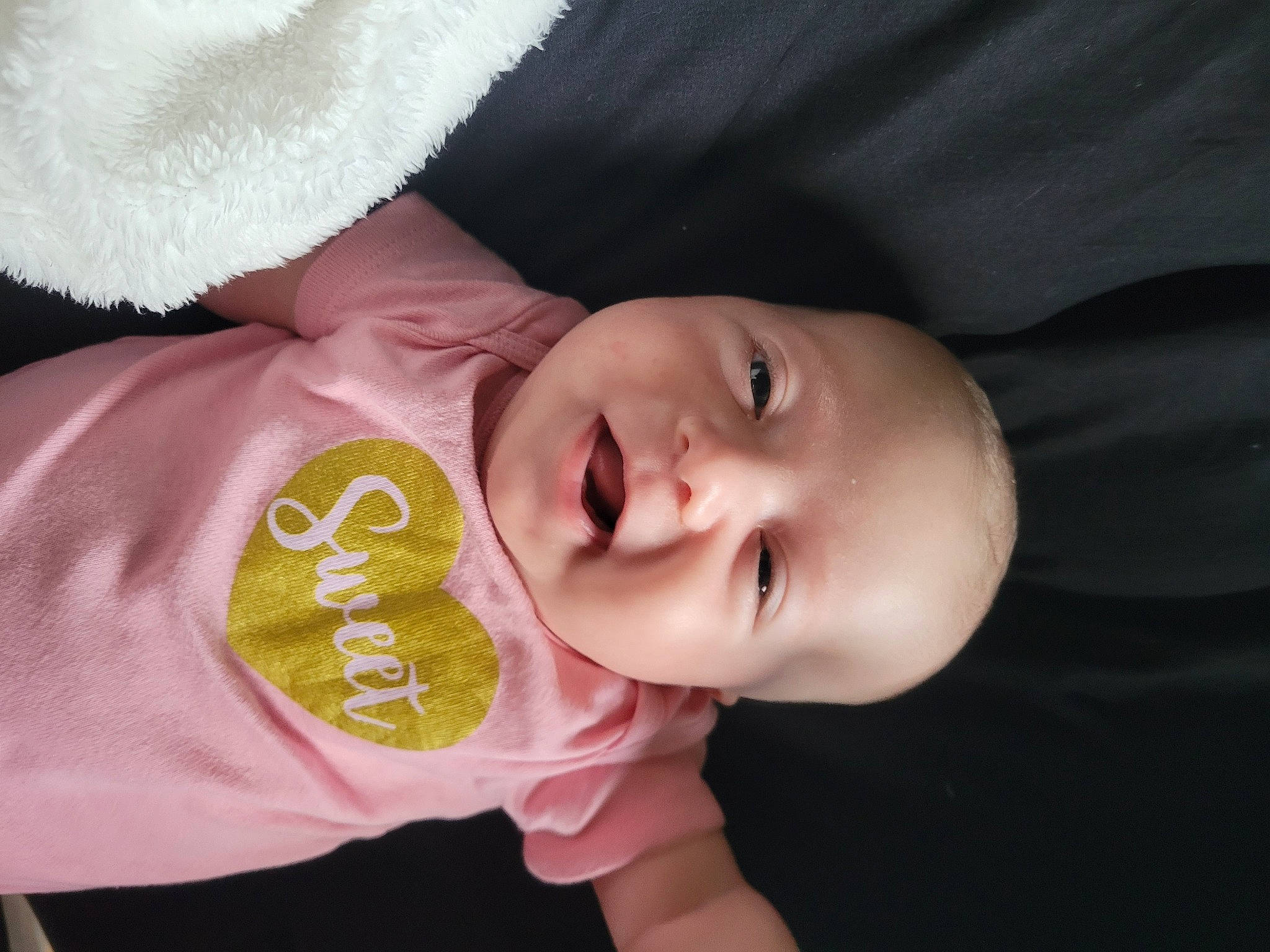 Iris Evelyn joined the competition — help win amazing prizes! baby, baby_toddler_clothing, cheek, chin, comfort, ear, eyebrow, finger, flash_photography, hand, happy, iris, lip, mouth, neck, nose, person, skin, sleeve, smile