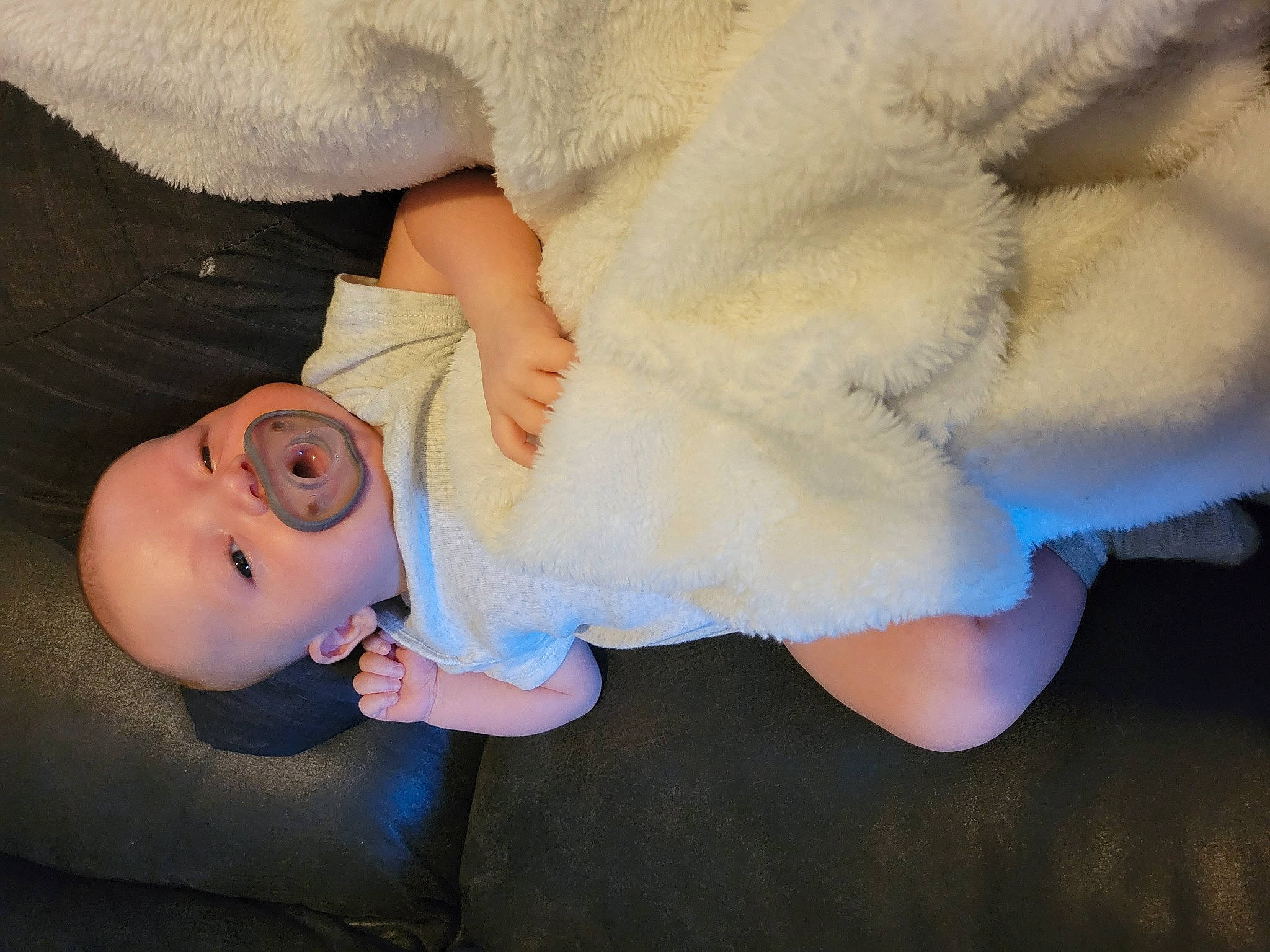 Iris Evelyn is registered to the contest to win money with this photo: baby, baby_toddler_clothing, child, comfort, finger, gesture, hand, happy, hat, headgear, human_body, leg, mammal, nail, nose, person, skin, stuffed_toy, textile, toddler