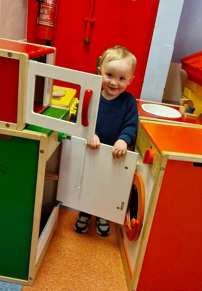 Tommy is registered to the contest to win money with this photo: baby, bathroom, clothing, face, footwear, furniture, head, indoorplayarea, indoors, interiordesign, machine, pants, person, photography, playarea, portrait, room, shoe, toilet, wheel