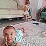 Kénaï participe au concours pour gagner de l'argent avec cette photo : baby, toddler, toy, carpet, vacuum_cleaner, living_room, couch, diaper, child, floor, furniture, smiling, play, indoor, home, pattern, person, cute, happy, cleaning