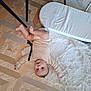 Kénaï a rejoint le concours — aidez-le/la à gagner de superbes lots ! arms, baby, child, clothing, curious, cushion, fabric, face, feet, floor, head, indoor, light, looking, pattern, person, playful, rug, soft, wooden_floor