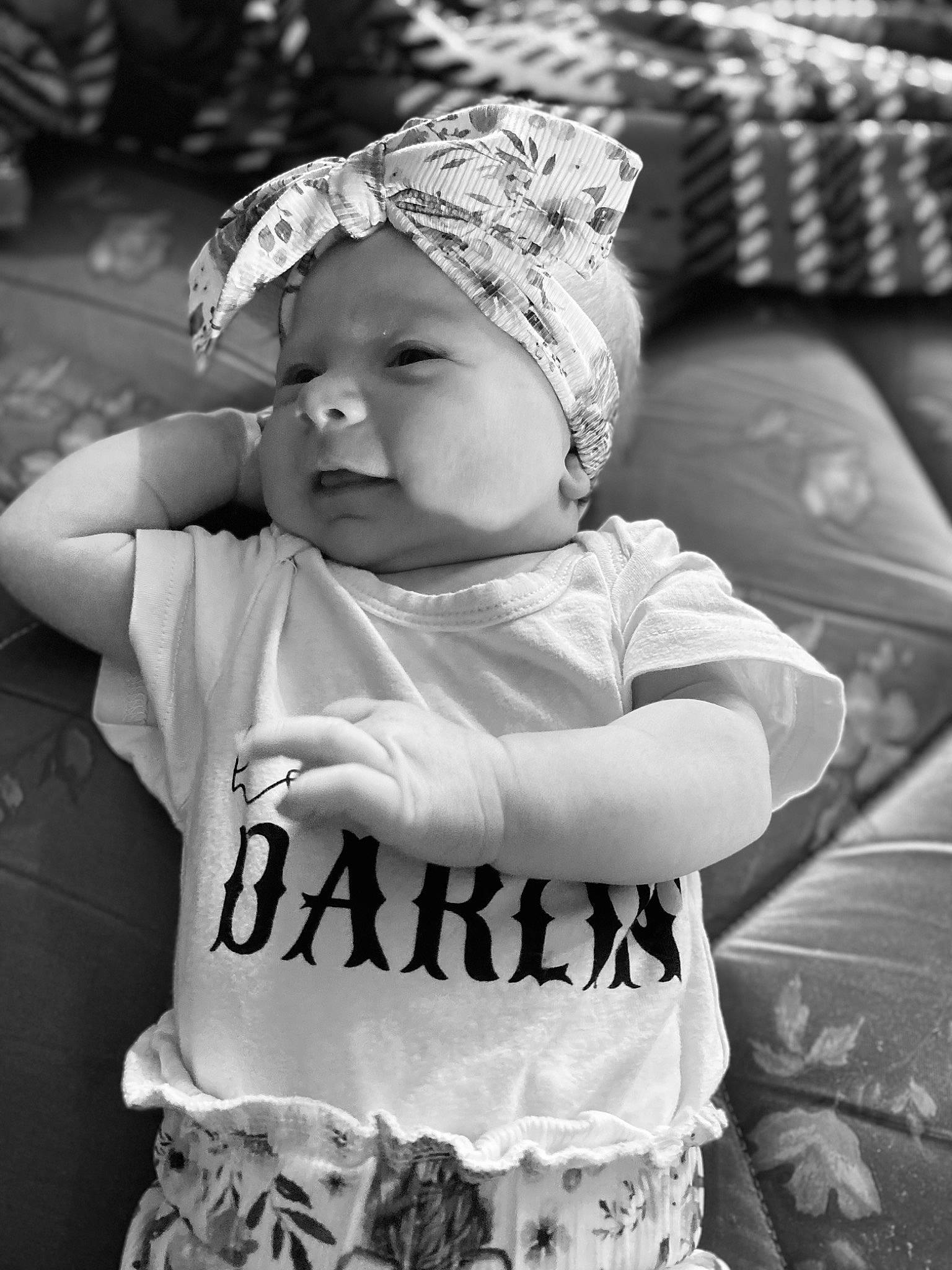 Tatum is registered to the contest to win money with this photo: baby, baby_toddler_clothing, black, black_and_white, cap, child, cool, eye, flash_photography, fun, grass, happy, headgear, headwear, person, photograph, sleeve, smile, standing, style