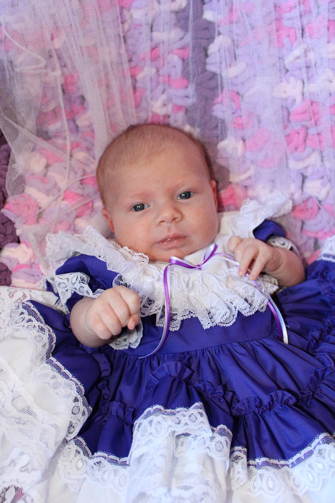Tatum is registered to the contest to win money with this photo: baby, baby_toddler_clothing, cheek, child, day_dress, embellishment, eye, flash_photography, happy, iris, linens, magenta, pattern, person, pink, purple, ruffle, skin, sleeve, toddler