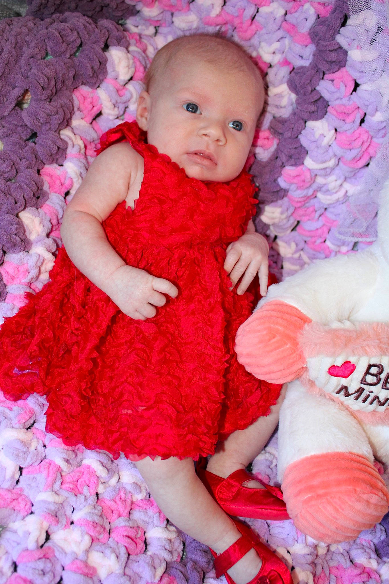 Tatum is registered to the contest to win money with this photo: baby, baby_toddler_clothing, child, day_dress, dress, facial_expression, finger, hand, happy, magenta, one_piece_garment, person, pink, product, purple, red, skin, sleeve, textile, toddler