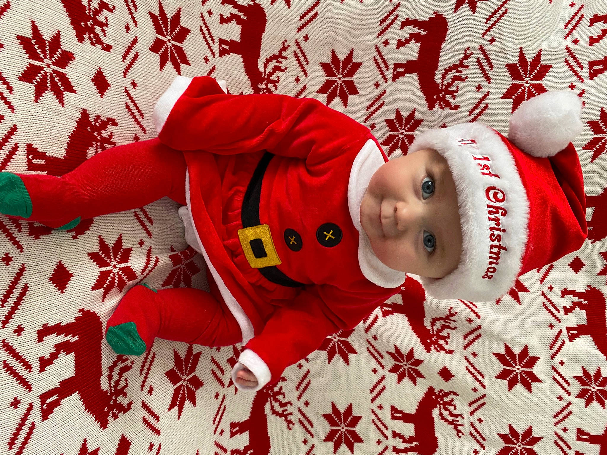 Margot is registered to the contest to win money with this photo: art, baby, baby_toddler_clothing, carmine, child, christmas, christmas_decoration, christmas_eve, christmas_ornament, event, font, happy, headwear, holiday, ornament, pattern, person, red, santa_claus, sleeve
