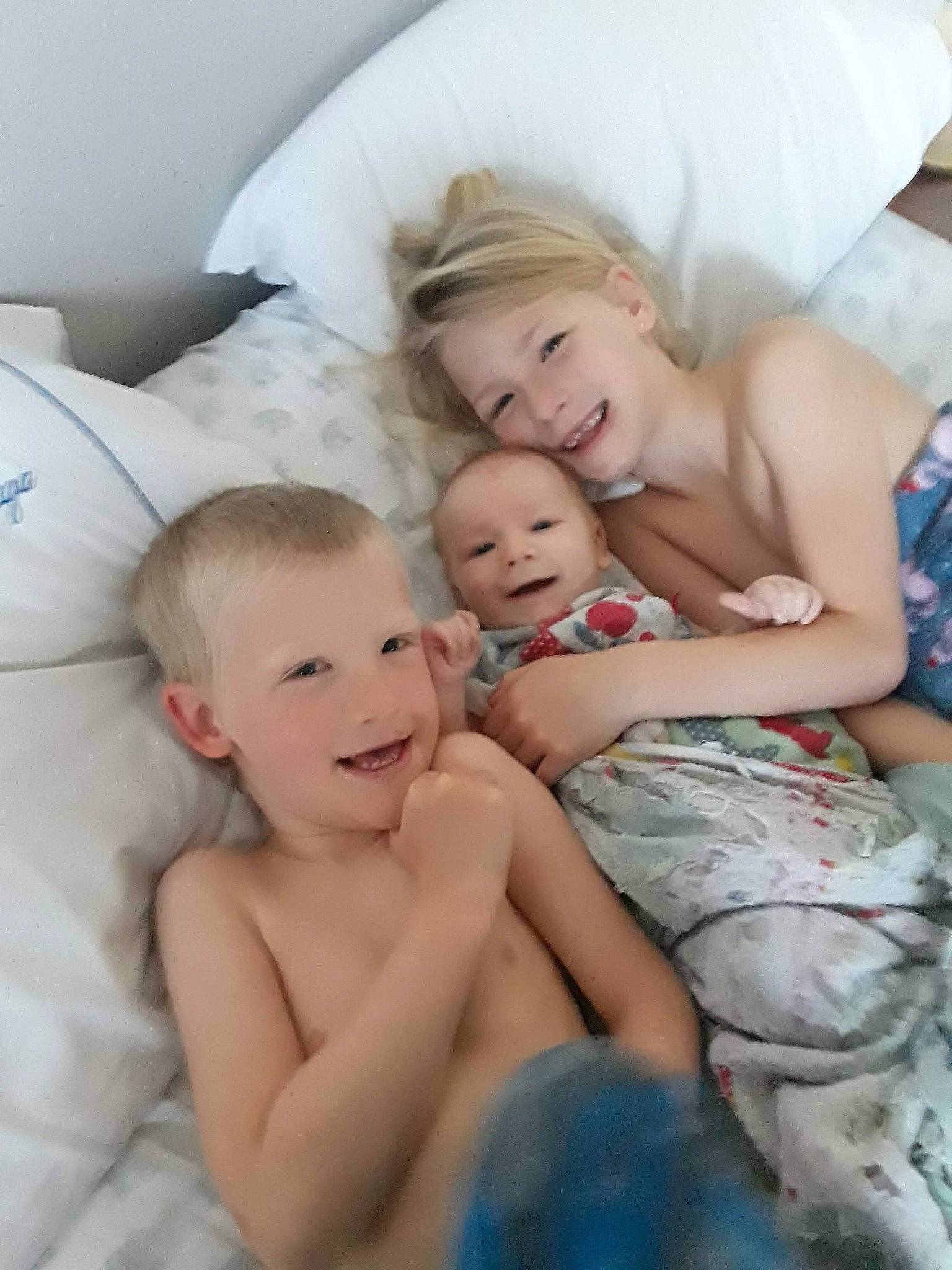 Cullen is registered to the contest to win money with this photo: baby, bedtime, child, comfort, joy, linens, mother, person, sibling, skin, textile, toddler