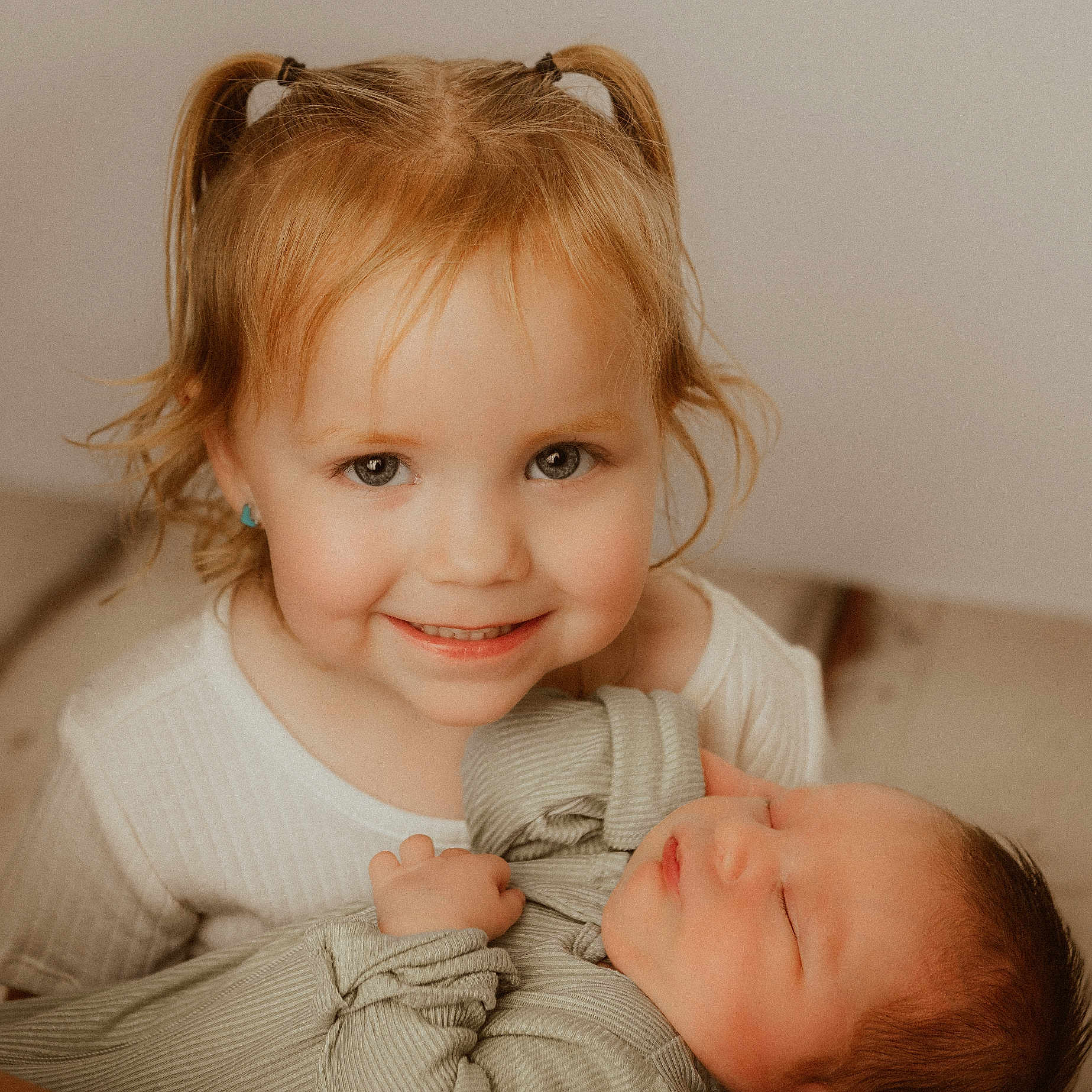 Elianna joined the competition — help win amazing prizes! baby, blonde, bodypart, clothing, couch, face, finger, furniture, hair, hand, happy, head, knitwear, newborn, person, photography, portrait, smile, sweater