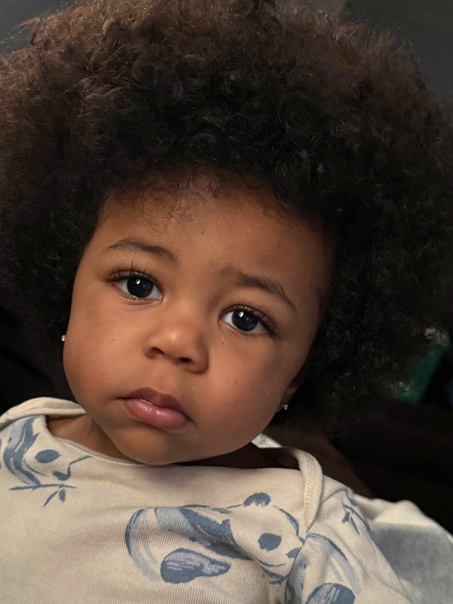 Tylin joined the competition — help win amazing prizes! toddler, child, portrait, face, curly_hair, eyes, expression, clothing, panda_print, baby, cute, indoor, soft_light, close_up, person, young_child, skin, earrings, casual, cozy