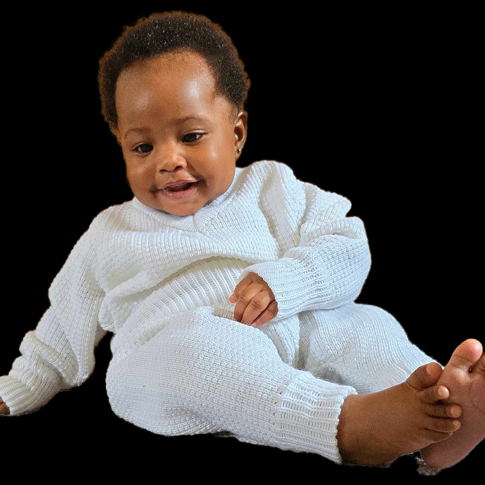 Jasmine is registered to the contest to win money with this photo: baby, barefoot, child, cozy, cute, happy, indoors, infant, isolated, knitted_clothing, person, portrait, relaxed, sitting, small_feet, small_hands, smiling, studio_style, white_outfit, young_child