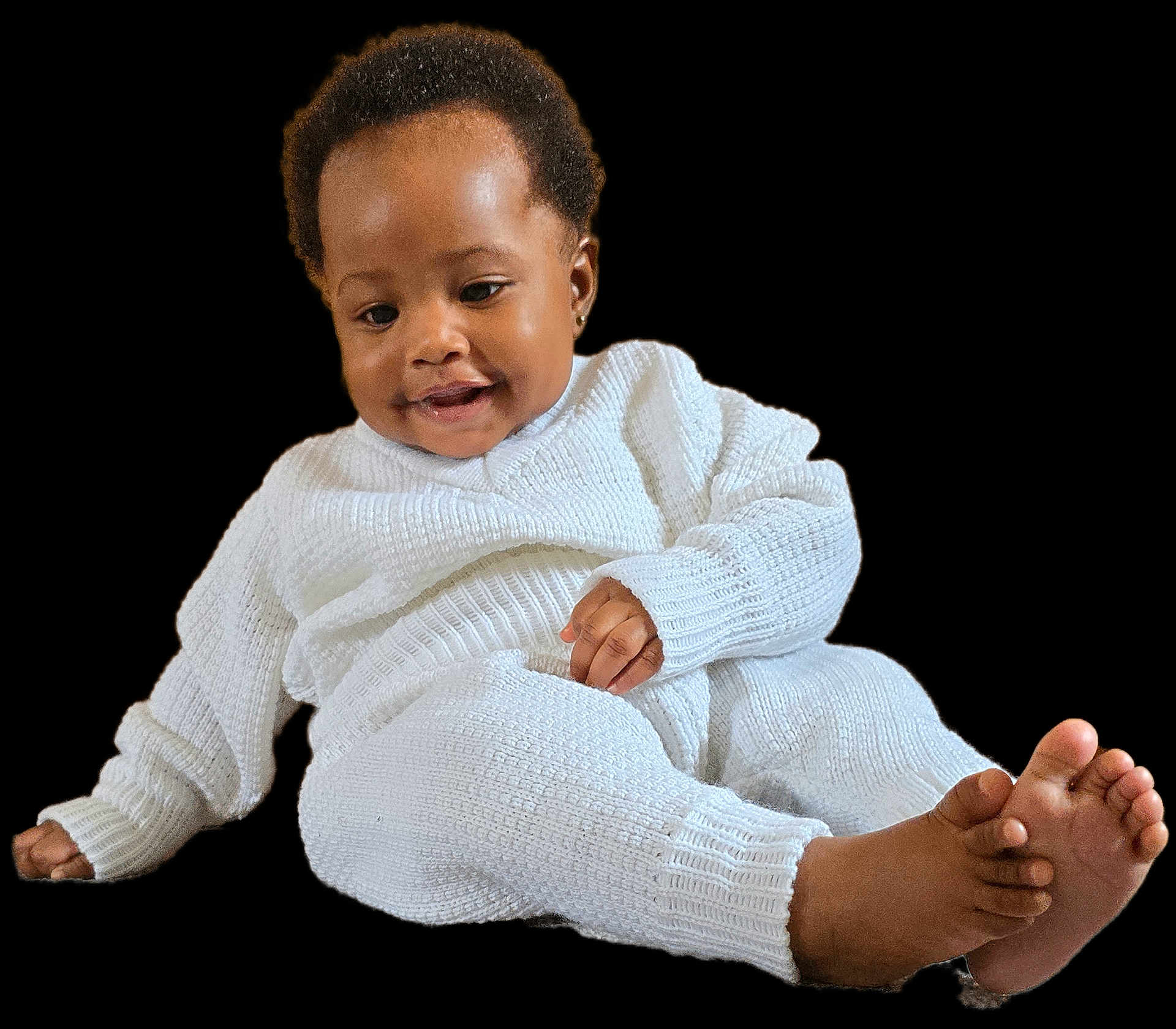 Jasmine is registered to the contest to win money with this photo: baby, child, smiling, knitted_clothing, white_outfit, barefoot, cute, infant, portrait, relaxed, happy, sitting, small_hands, small_feet, cozy, young_child, indoors, isolated, studio_style, person