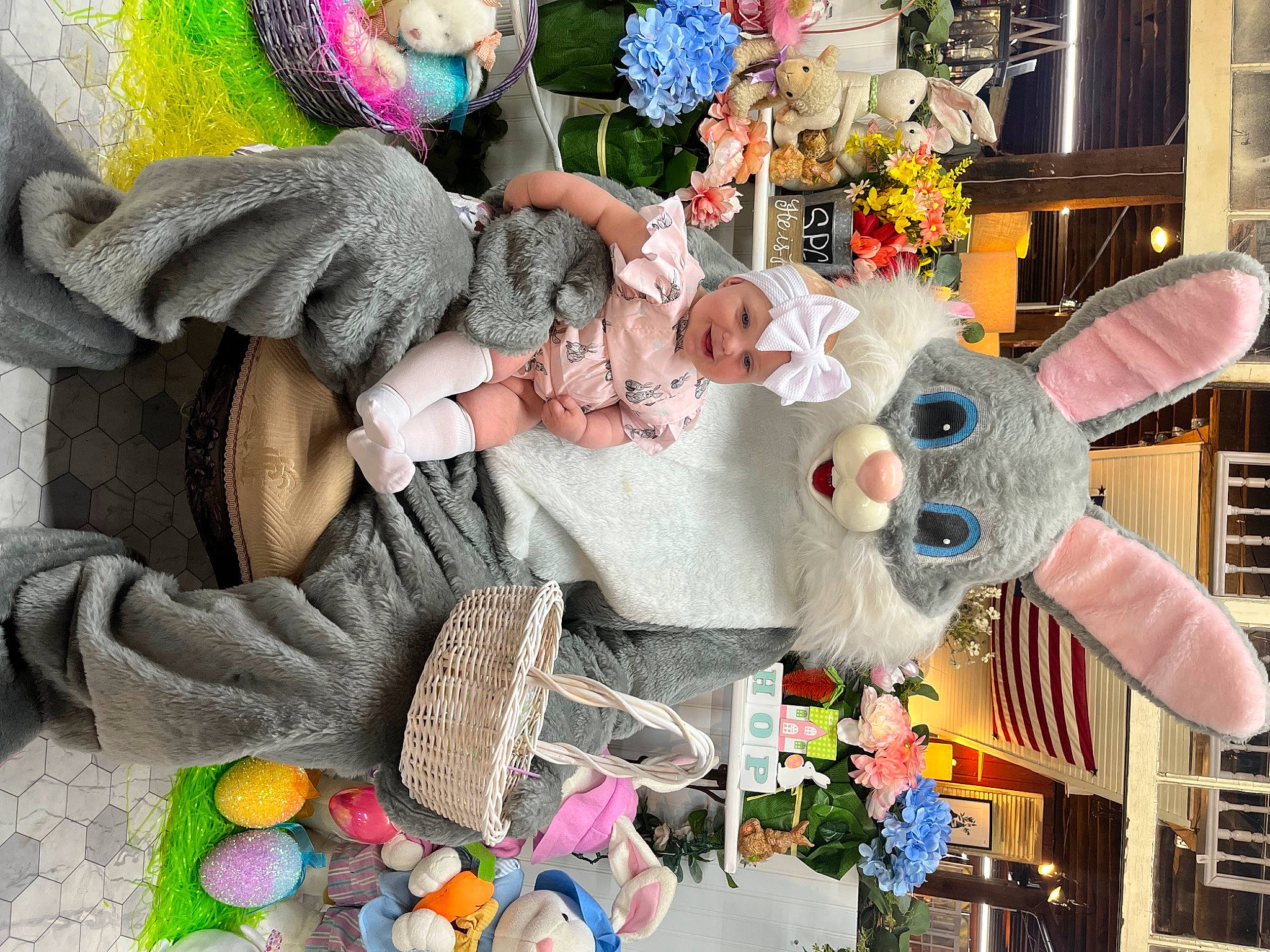 Brylee is registered to the contest to win money with this photo: art, baby, baby_products, baby_toddler_clothing, basket, child, event, flower, headwear, joy, person, pink, plant, purple, room, snapshot, storage_basket, stuffed_toy, textile, toddler