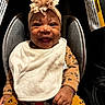 Myalinn is registered to the contest to win money with this photo: baby, smile, headband, flower, bib, car_seat, leopard_print, clothing, infant, child, happy, cute, portrait, sitting, hands, face, indoors, closeup, seatbelt, young