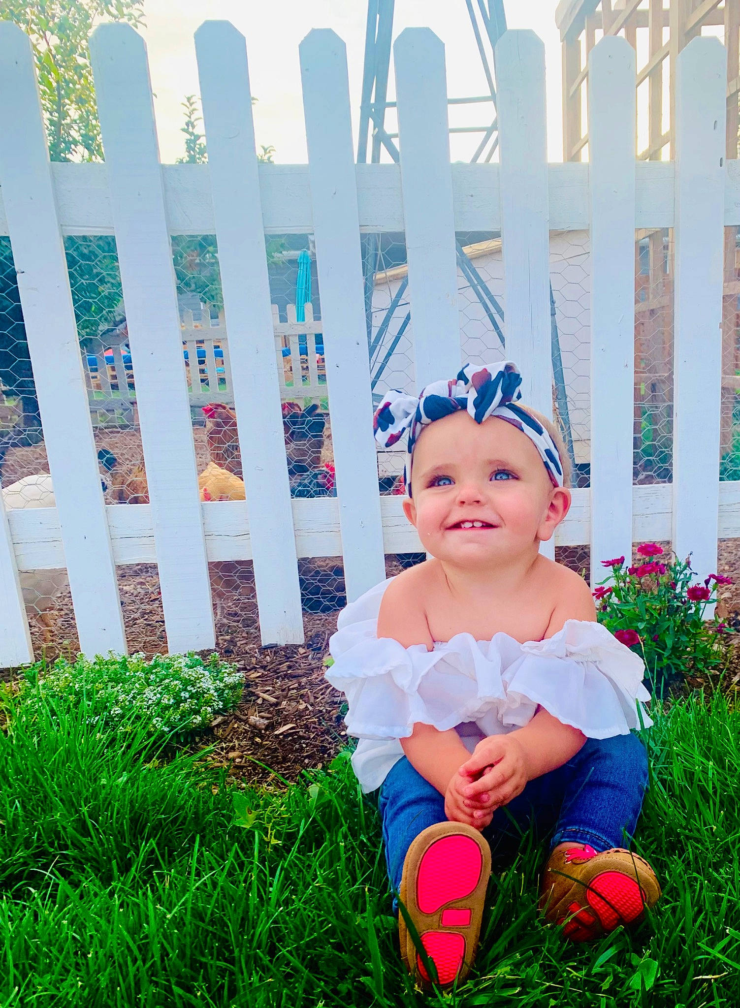 Kinnley is registered to the contest to win money with this photo: baby, baby_toddler_clothing, cap, electric_blue, fence, fun, garden, grass, grassland, happy, hat, headgear, headwear, joy, lawn, leaf, leisure, magenta, pattern, people_in_nature