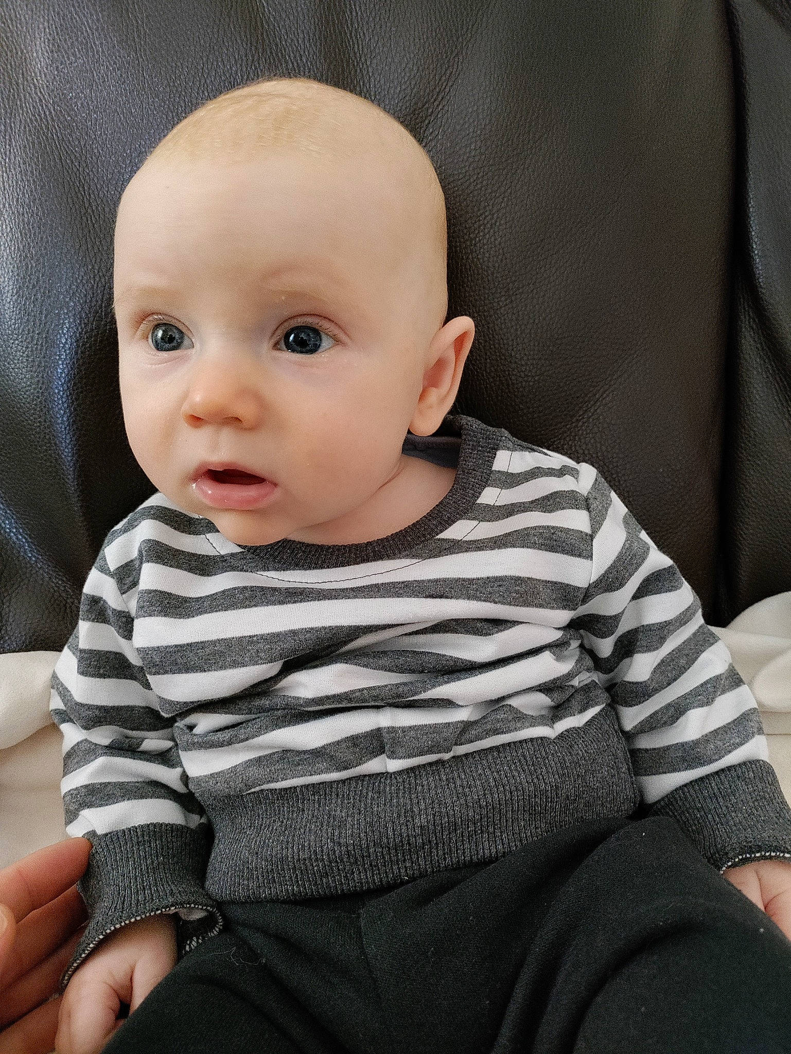 Sonny is registered to the contest to win money with this photo: baby, baby_toddler_clothing, cheek, child, chin, collar, comfort, grey, iris, monochrome, monochrome_photography, pattern, person, portrait_photography, sitting, skin, sleeve, surprise, t_shirt, toddler