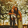 family, baby, child, man, woman, outdoor, nature, trees, sunlight, bokeh, portrait, smile, glasses, dress, jeans, boots, love, happy, together, parenting