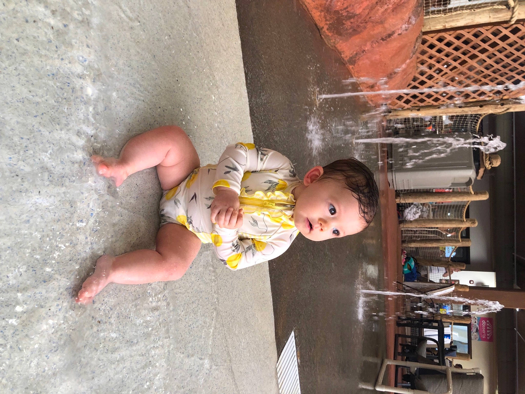 Evie is registered to the contest to win money with this photo: baby, baby_toddler_clothing, ceiling, child, concrete, dress, foot, fun, human_leg, leg, leisure, person, room, thigh, toddler, vacation