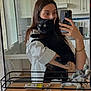 Nova a rejoint le concours — aidez-le/la à gagner de superbes lots ! black_cat, bracelet, casual, cat, countertop, furniture, holding, indoor, keychain, kitchen, long_hair, mirror, person, pet, reflection, selfie, smartphone, toy_dinosaurs, white_shirt, window
