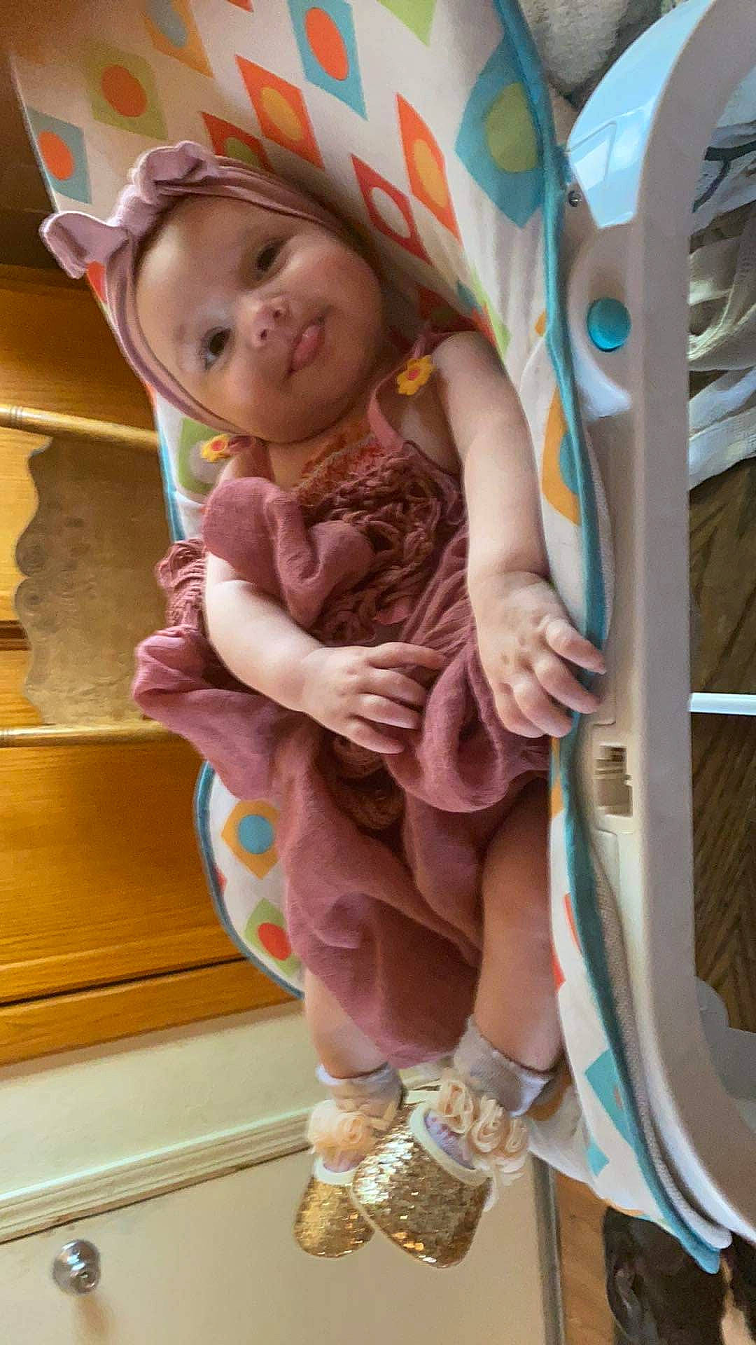 Avery joined the competition — help win amazing prizes! baby, baby_products, baby_toddler_clothing, child, eye, fun, happy, head, headwear, human_leg, magenta, pattern, person, pink, sitting, skin, smile, sock, thigh, thumb