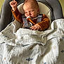 baby, newborn, sleeping, blanket, baby_seat, clothing, infant, face, hand, fist, comfort, rest, indoors, soft, cute, peaceful, child, toddler, fabric, strap
