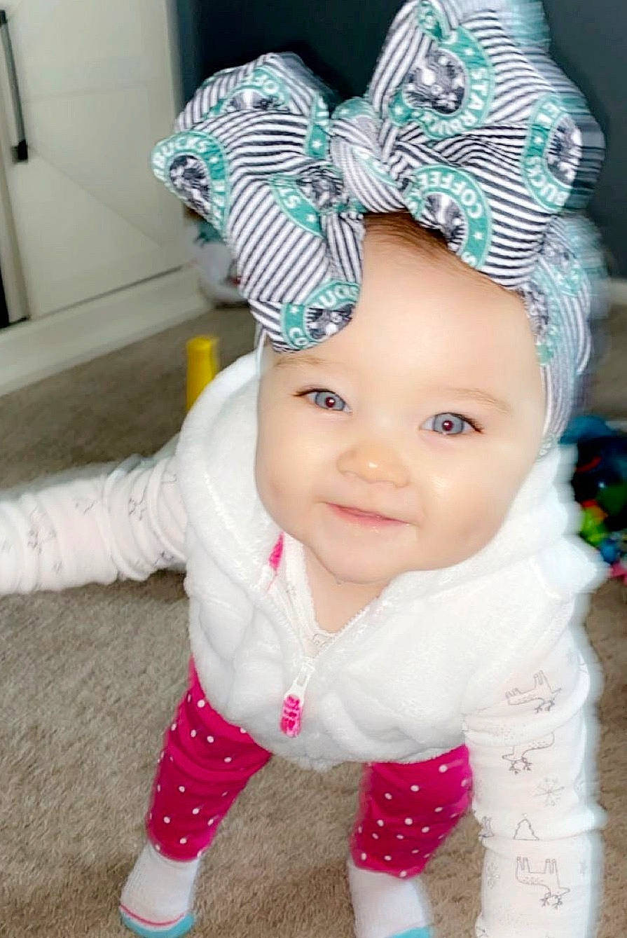 Greycyn is registered to the contest to win money with this photo: baby, baby_toddler_clothing, beanie, bonnet, cap, child, clothing, crochet, ear, fashion_accessory, hair_accessory, hat, headgear, knit_cap, pattern, person, pink, smile, toddler