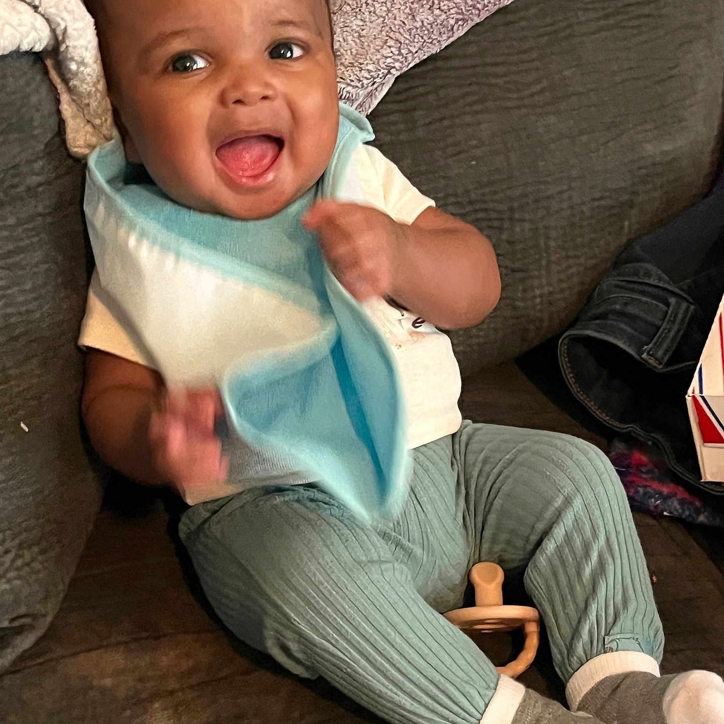 Keifari Turner is registered to the contest to win money with this photo: baby, babylaughing, clothing, couch, cushion, face, furniture, happy, head, homedecor, hosiery, jeans, laughing, pants, person, photography, portrait, sitting, smile, sock