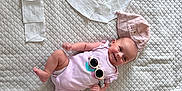 Mayline participe au concours pour gagner de l'argent avec cette photo : baby, baby_care, child, closeup, cute, face_mask, happy, indoor, infant, lying_down, number_ten, paper_towels, pink_hat, pink_onesie, portrait, quilted_bedspread, smiling, soft_lighting, sunglasses, sunscreen