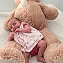 baby, child, comfort, cozy, cuddly, cute, happy, indoors, infant, person, pink_clothing, playful, plush_toy, portrait, quilted_blanket, relaxed, small_child, smiling, soft_toy, teddy_bear