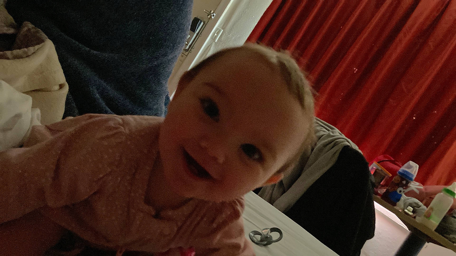 Kendall is registered to the contest to win money with this photo: baby, baby_toddler_clothing, cheek, child, comfort, curtain, ear, eyelash, fun, happy, iris, lip, mouth, nose, person, sitting, skin, smile, thumb, toddler