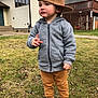 Zayn joined the competition — help win amazing prizes! toddler, child, boy, hat, cap, gray_hoodie, pants, sneakers, grass, yard, house, sidewalk, outdoor, fall, casual_clothing, curious_expression, standing, gesture, daylight, building