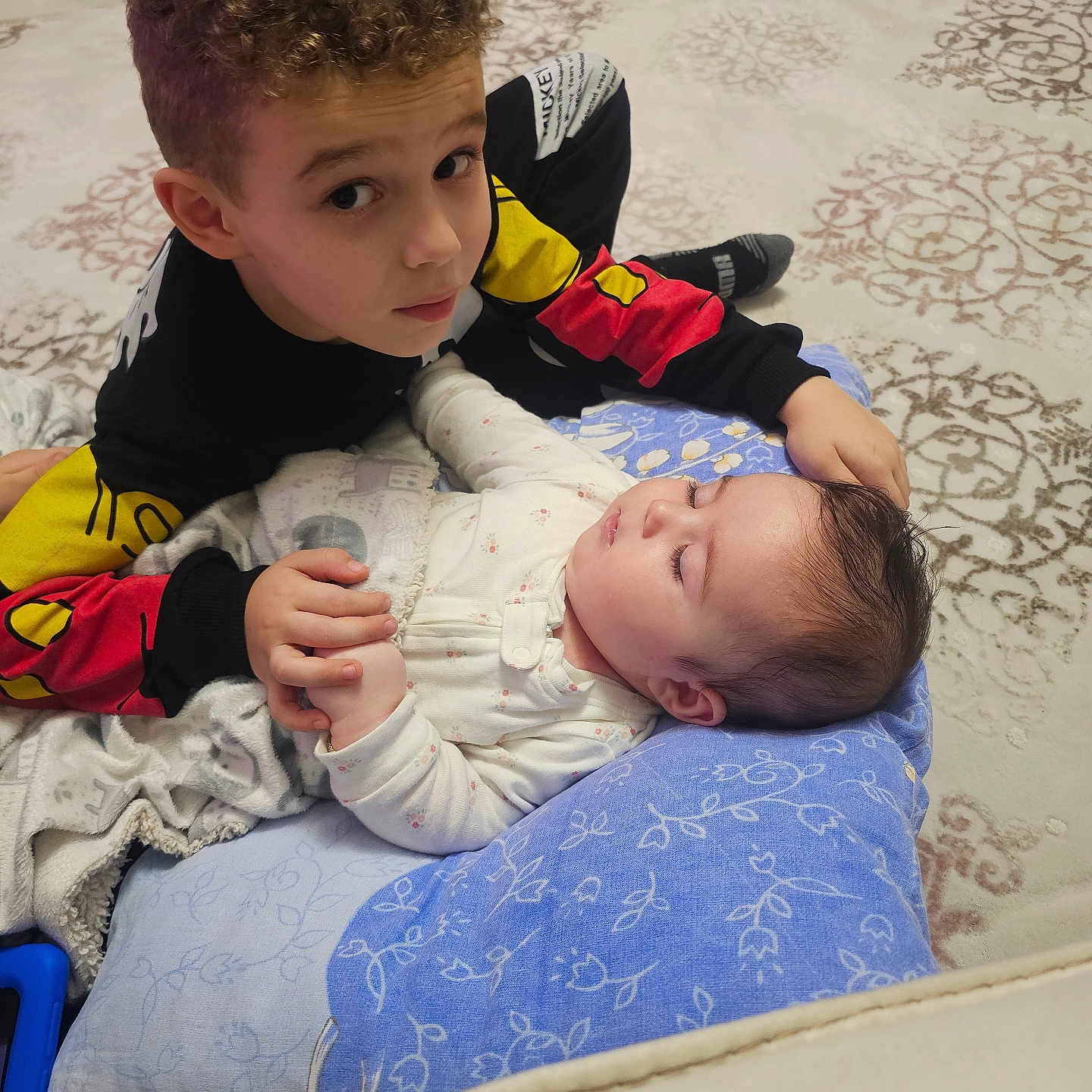 ömer Alp joined the competition — help win amazing prizes! child, baby, sibling, sleeping, curly_hair, smiling, portrait, indoor, bedroom, bed, blanket, pillow, bedding, clothing, hands, family, cuddling, peaceful, infant, photography