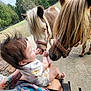 Rosemary joined the competition — help win amazing prizes! baby, child, miniature_horse, animal, pet, outdoor, grass, nature, person, tattoo, hand, foot, cute, interaction, farm, animal_face, onesie, shorts, friendly, daylight