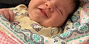 Rosemary joined the competition — help win amazing prizes! baby, smiling, blanket, patterned_blanket, sleeping, cute, infant, face, soft, cozy, wrapped, child, newborn, happy, small_hand, clothing, indoors, portrait, head, peaceful