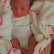 Kamarie is registered to the contest to win money with this photo: newborn, baby, sleeping, infant, blanket, swaddled, pastel, cozy, portrait, indoors, bedding, onesie, foot, toes, head, face, peaceful, resting, soft, closeup