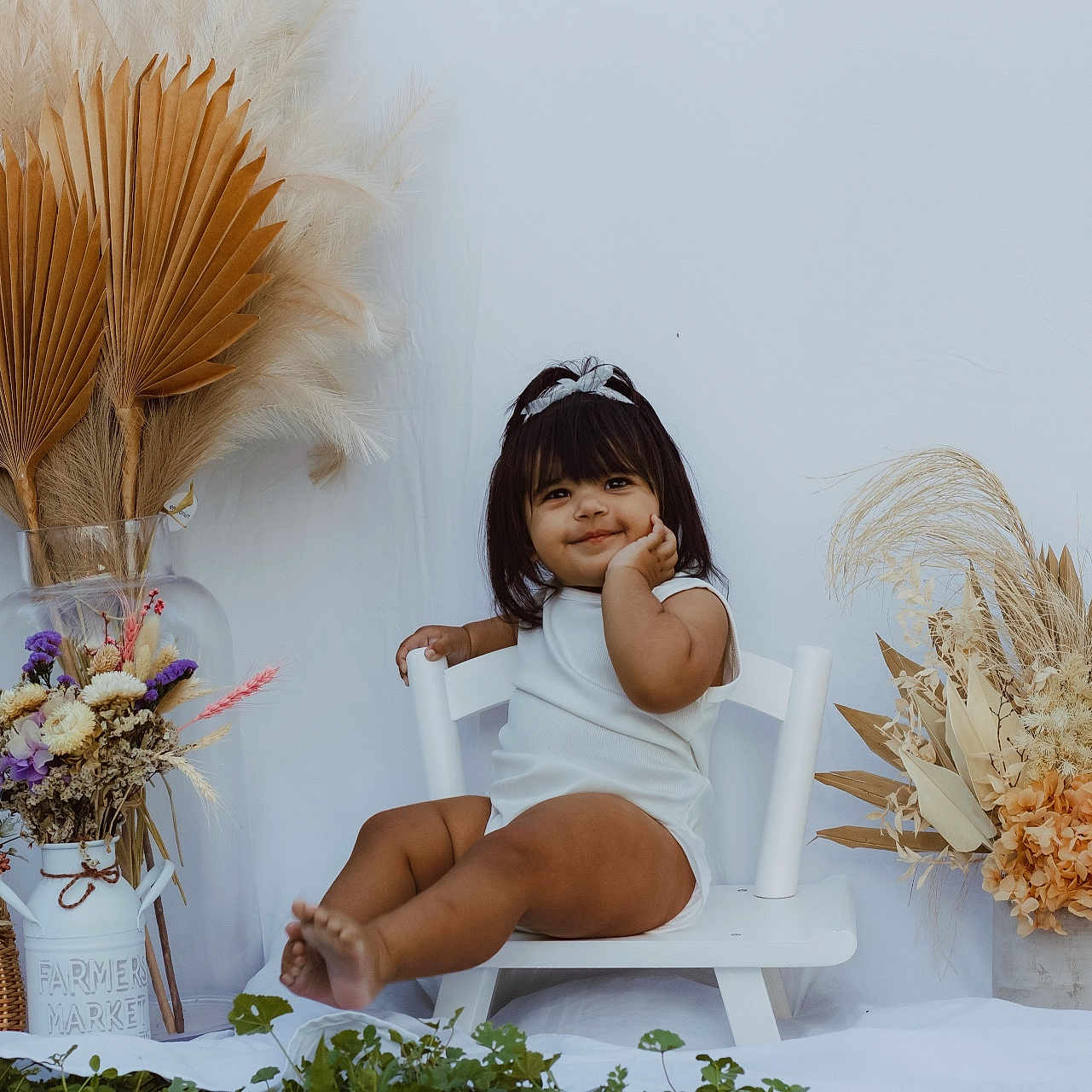 Zali joined the competition — help win amazing prizes! baby, basket, chair, child, cute, decor, dried_flowers, flower_arrangement, furniture, happy, headband, indoor, natural_light, plant, portrait, sitting, smiling, toddler, vase, white_clothing