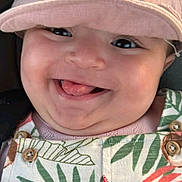 Layel participe au concours pour gagner de l'argent avec cette photo : baby, child, smile, tongue, hat, bear_hat, overalls, patterned_clothing, close_up, happy, cute, chubby_cheeks, portrait, infant, colorful_clothing, playful, face, headwear, young_child, joyful
