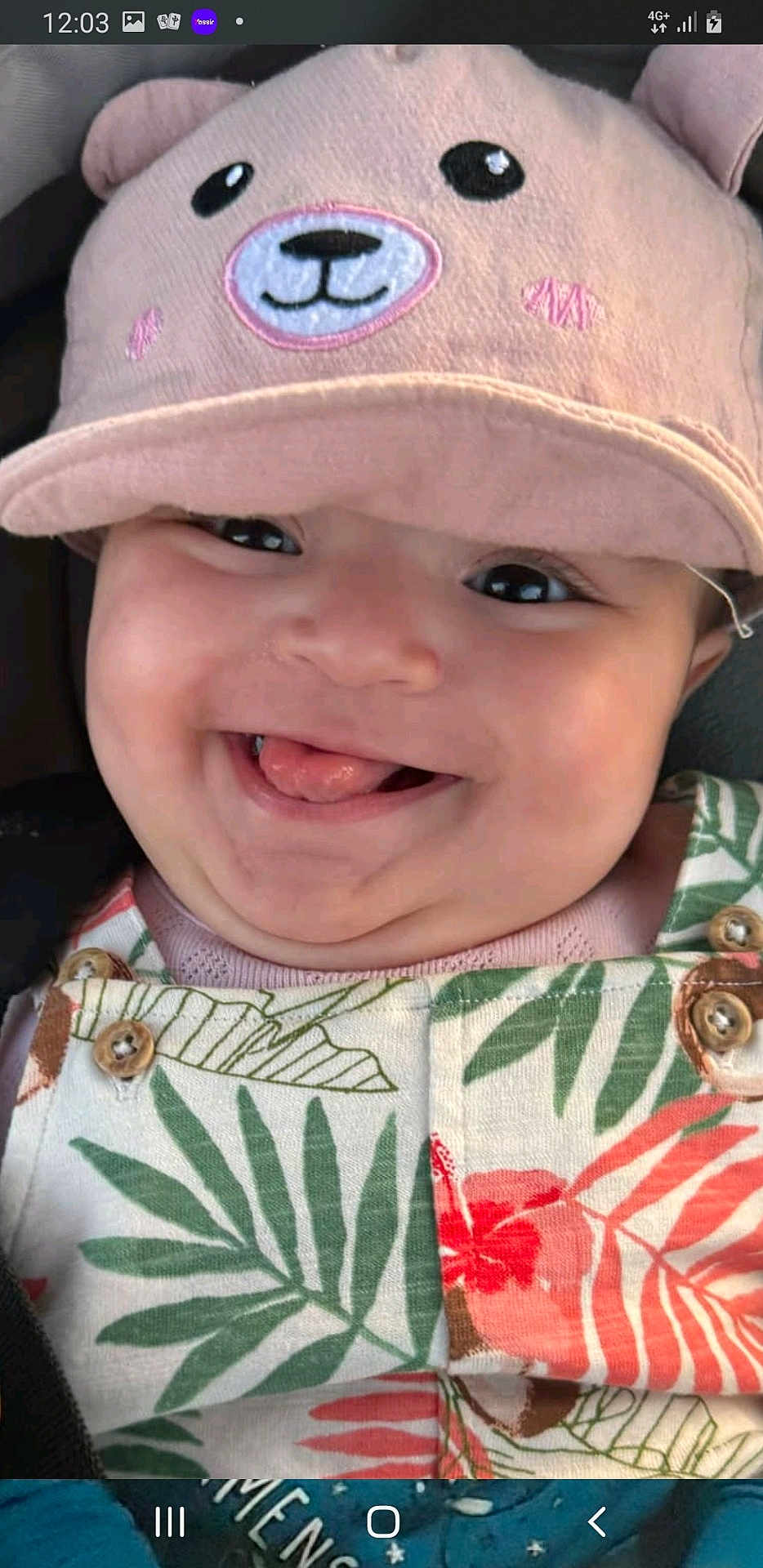 Layel participe au concours pour gagner de l'argent avec cette photo : baby, child, smile, tongue, hat, bear_hat, overalls, patterned_clothing, close_up, happy, cute, chubby_cheeks, portrait, infant, colorful_clothing, playful, face, headwear, young_child, joyful