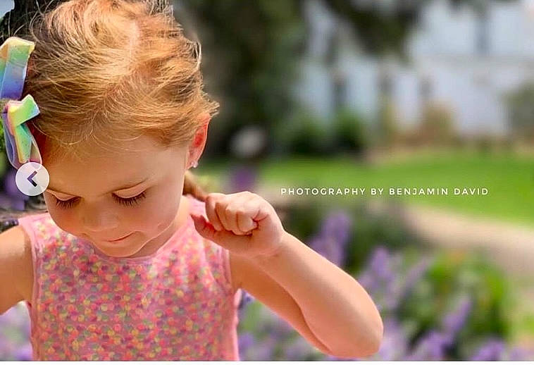 Maddilyn joined the competition — help win amazing prizes! baby, baby_toddler_clothing, child, dress, fashion_accessory, finger, fun, gesture, grass, green, hair, hair_tie, happy, leisure, pattern, people_in_nature, person, plant, recreation, summer