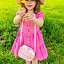 child, girl, flower, dandelion, pink_dress, hat, sandals, grass, tree, outdoor, nature, smiling, greenery, bag, summer, cute, happy, standing, portrait, playful