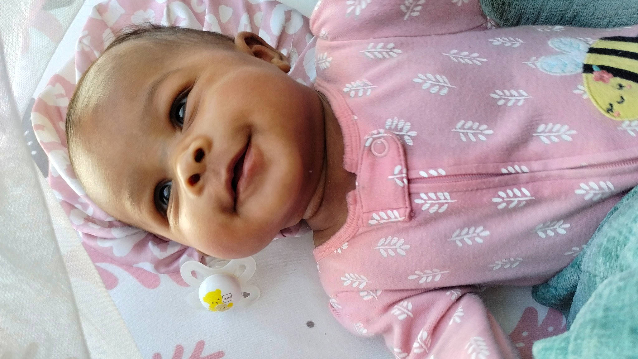 Jupiter joined the competition — help win amazing prizes! baby, baby_toddler_clothing, cheek, child, chin, comfort, eyebrow, eyelash, facial_expression, happy, joy, linens, lip, mouth, nose, person, pink, skin, sleeve, smile