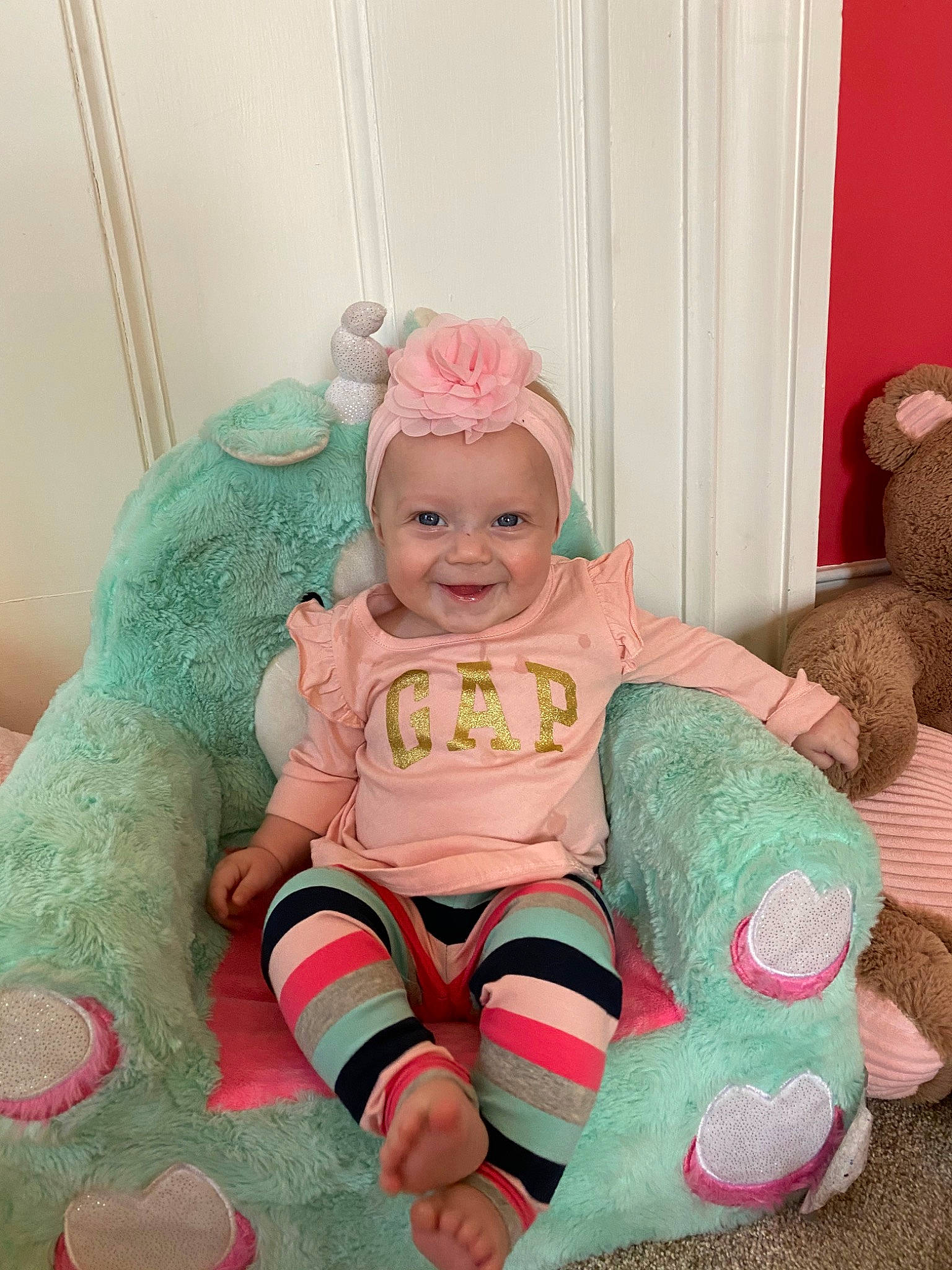 Melanie Trisha Rose is registered to the contest to win money with this photo: baby, child, joy, person, pink, play, plush, sitting, smile, stuffed_toy, toddler, toy