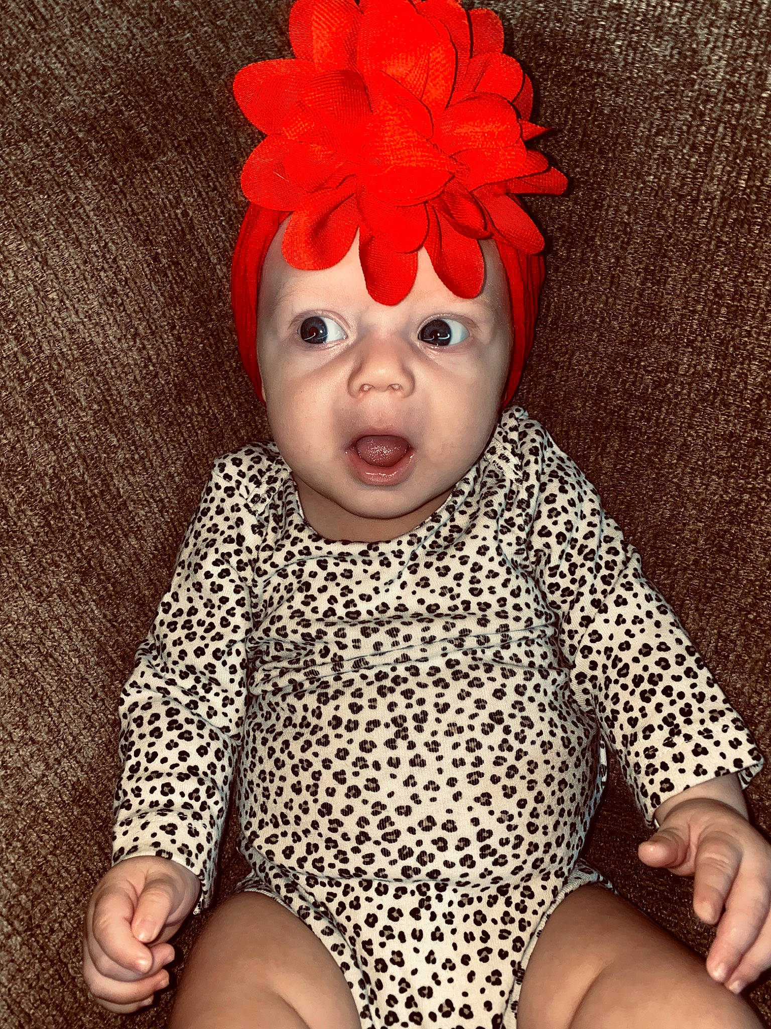 Melanie Trisha Rose is registered to the contest to win money with this photo: baby, baby_toddler_clothing, child, costume, costume_accessory, design, face, hair_accessory, head, headgear, headpiece, orange, pattern, person, polka_dot, red, red_hair, toddler