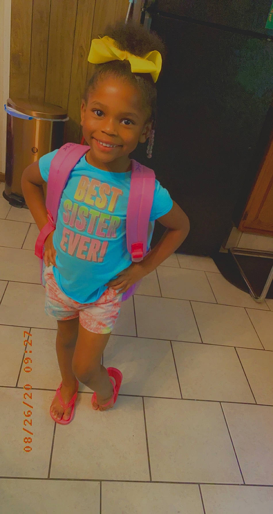 Azaria is registered to the contest to win money with this photo: ankle, baby, baby_toddler_clothing, child, flip_flops, floor, flooring, foot, hair_accessory, joy, nightwear, nose, person, sandal, slipper, sock, tile, tile_flooring, toddler, toe