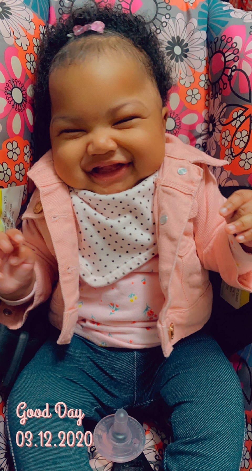 Amari is registered to the contest to win money with this photo: baby_toddler_clothing, cheek, child, eye, facial_expression, finger, hand, happy, lip, mouth, nail, nose, peach, person, pink, sitting, skin, thumb, toddler, tongue