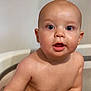 baby, child, blue_eyes, bathtub, water, wet_skin, curious, close_up, infant, portrait, skin, face, head, expression, indoors, cute, young, human, naked_torso, tub
